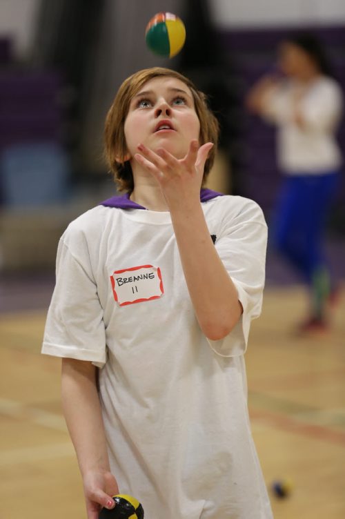 Breanne Pilon, 10, concentrates as she masters her juggling skills at the 17th annual Circus and Magic Partnership (C.A.M.P) at Gordon Bell High School in Winnipeg on Tuesday, April 1, 2014. C.A.M.P is an artistic intervention project for at-risk kids, spearheaded by the Winnipeg International Children's Festival . (Photo by Crystal Schick/Winnipeg Free Press)