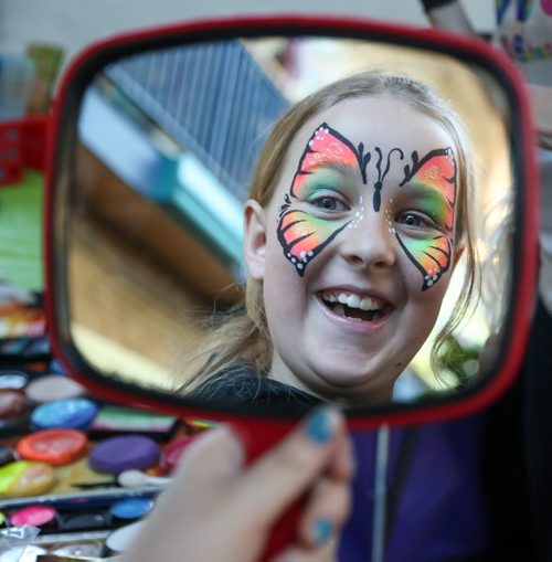 Kayla Landry, 10, loves butterfly face painting that she received at the 14th annual Festival of Fools at The Forks in Winnipeg on Tuesday, April 1, 2014. The free festival of foolishness runs Saturday, March 29 to Sunday, April 6. (Photo by Crystal Schick/Winnipeg Free Press)