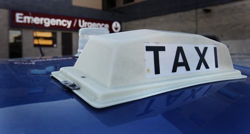 April 1, 2014 - 140401  -  A city cab waits for a customer at St. Boniface Hospital in Winnipeg Tuesday, April 1, 2014. John Woods / Winnipeg Free Press