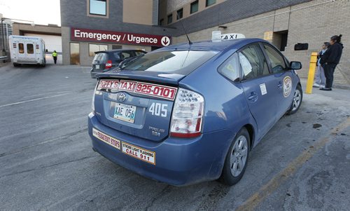 April 1, 2014 - 140401  -  A city cab waits for a customer at St. Boniface Hospital in Winnipeg Tuesday, April 1, 2014. John Woods / Winnipeg Free Press