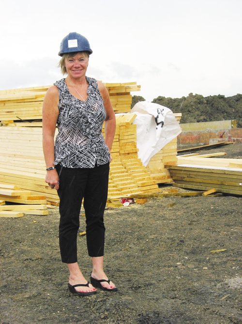 Canstar Community News July 16, 2013 - Randall Homes sales consultant Cheryl Thurston stands next to the site where the first four condos are being built in the Oak Bluff West development. (ANDREA GEARY/CANSTAR)