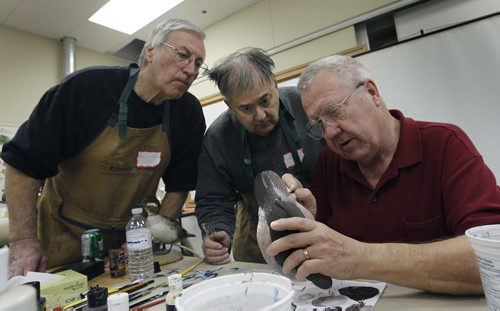 At right,  Glenn McMurdo, a wildfowl sculptor from Cobourg, Ontario  with students John Frye (centre) and Ron Pozernick during his three day duck painting workshop held at Lee Valley Tools. Glenn is a world renown duck carver and will be judging at the 28th annual Prairie Canada Carving Championship and show April 5 & 6 held at the Canad Inns Polo Park. The 2014 competition is expected to draw 300 hand-crafted carvings and turnings of wood, bone, stone and antler from 100-plus carvers from Ontario, the Prairie Provinces and adjoining States. Admission for the show is $5.00 for adults and children are admitted free.   see release   Wayne Glowacki / Winnipeg Free Press April 3   2014