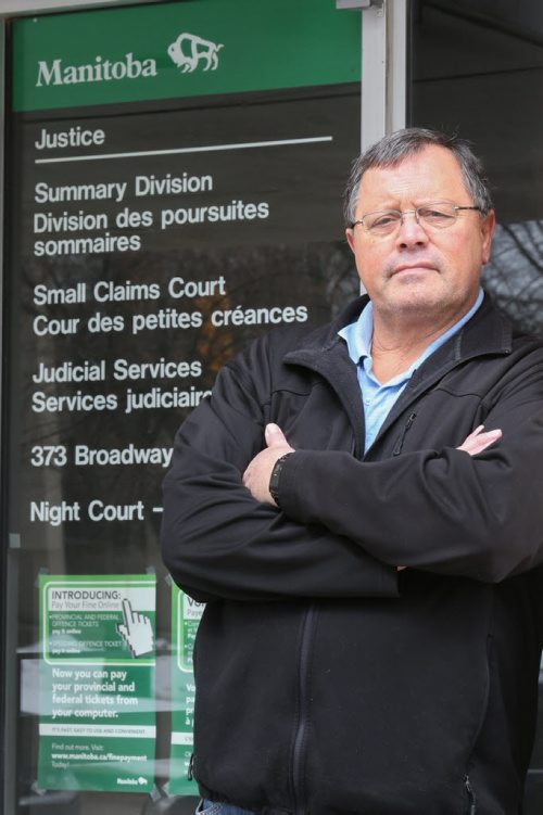 Len Eastoe, traffic ticket expert and former police officer, in front of the traffic court building in Winnipeg on Friday, April 4, 2014.  (Photo by Crystal Schick/Winnipeg Free Press)