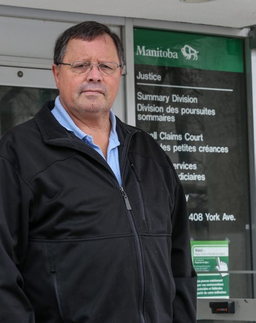 Len Eastoe, traffic ticket expert and former police officer, in front of the traffic court building in Winnipeg on Friday, April 4, 2014.  (Photo by Crystal Schick/Winnipeg Free Press)