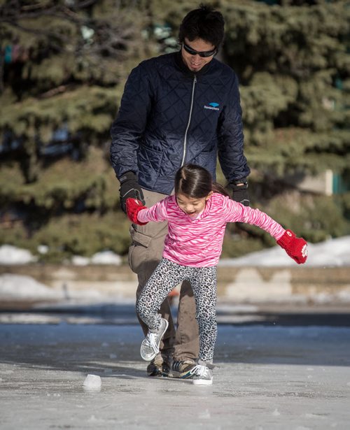 The skating rink at the Forks is closed for the season, but that didn't stop Chylsy Marable from challenging her dad Jay to a game of foot hockey on the melted rink Friday afternoon. 140404 - Friday, {month name} 04, 2014 - (Melissa Tait / Winnipeg Free Press)