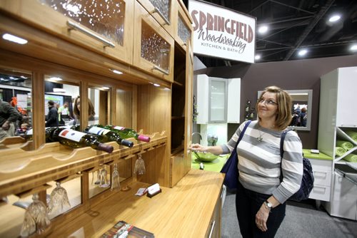 Patti Dola looks at a kitchen display at the  Home Expression Show at the Convention Centre Saturday. See story.   April 05,  2014 Ruth Bonneville / Winnipeg Free Press