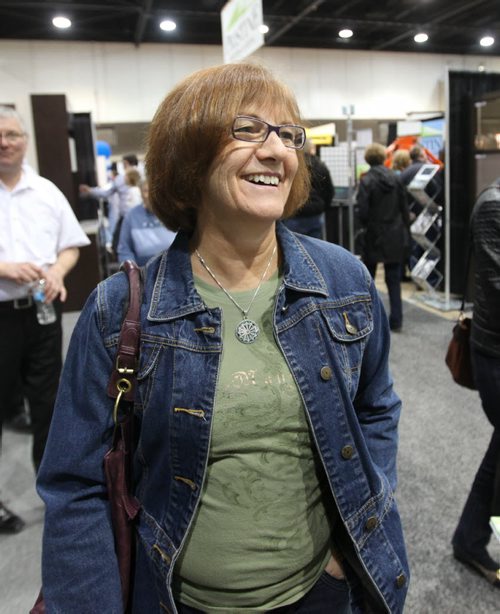 Deb Skrabek enjoys displays at the  Home Expression Show at the Convention Centre Saturday. See story.   April 05,  2014 Ruth Bonneville / Winnipeg Free Press