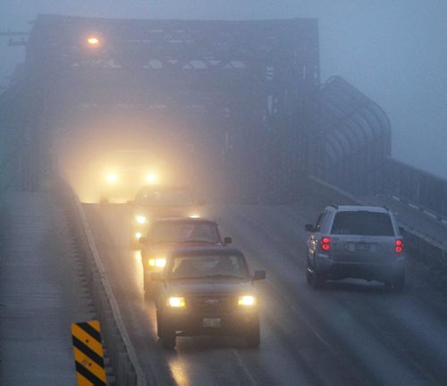Traffic rolls over the Arlington Bridge through ice fog Monday morning.   Wayne Glowacki / Winnipeg Free Press April 7   2014