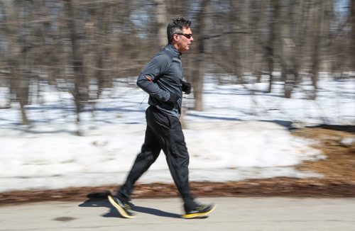 Dwayne Krushel takes advantage of the nice weather and does his first outdoor jog of the season in St. Vital Park in Winnipeg on Tuesday, April 8, 2014. (Photo by Crystal Schick/Winnipeg Free Press/Winnipeg Free Press)