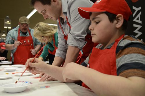 Spencer Lambert, 13, paints at the Easter Seals SMD Foundation media event at Safeway Osborne Village.  The motto of the event was to find ability in disability through inclusive camp model.  EMILY CUMMING / WINNIPEG FREE PRESS APRIL 8, 2014
