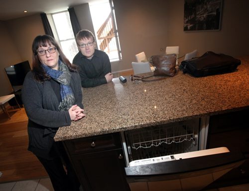 Timothy and Sherri Vanderstel pose it their whose rented-out condo which  was raided and wrecked by police . They are being denied damages by the city. At least so far. (The apartment has been mostly repaired now but they have photos of the damage to share). See Gordon Sinclair story.  April 8, 2014 - (Phil Hossack / Winnipeg Free Press)