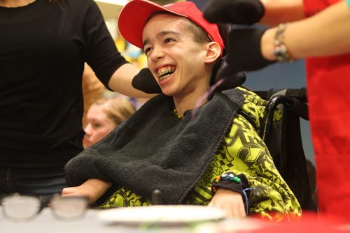 Nineteen year old Mitchell Potter is all smiles after showing off his beadwork he made while taking part in kickoff of Safeways annual fundraising campaign for Society for Manitobans with Disabilities Easter Seals Foundation which had a arts and crafts theme Tuesday morning  at the Osborne Safeway.  April 08  2014 Ruth Bonneville / Winnipeg Free Press