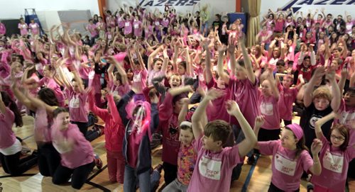 Students at Lincoln Middle School were wearing their pink T shirts and doing the wave while shouting "Stand for Respect" at the Canadian Red Cross Day of Pink celebration held at their school Wednesday. The event included words from James Allum, Education and Advanced Learning Minister and Obby Khan, former Winnipeg Blue Bomber player who spoke of his experiences of bullying and ended with anti-bulling videos produced by the students were shown. These students and staff were among the over 19,000 people across Manitoba standing for respect wearing pink T-shirts. In Manitoba more than 365 schools and businesses are hosting events that include film festivals, speakers' series, rallies, and parades to inspire others to recognize and respond to bulling.     see release. Wayne Glowacki / Winnipeg Free Press April 9   2014