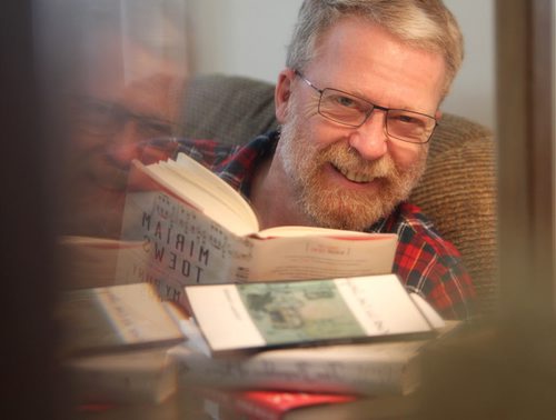 Duncan McMonagle reads a book by one of his favourite writers Miriam Toews as he muses about a living in a mystical world of literature which is his favourite place to be. Pictures to go with a  Our Winnipeg, feature for Sunday Extra -  april 13. April 08  2014 Ruth Bonneville / Winnipeg Free Press