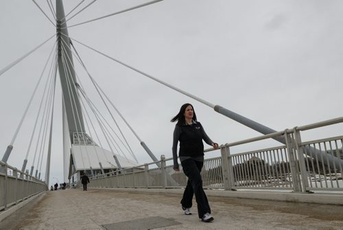 Dr. Adrienne Leslie-Toogood takes a walk across the Esplanade Riel bridge.  Leslie-Toogood is the director of sports psychology at the Canadian Sport Centre Manitoba and often walks to maintain good health.  EMILY CUMMING / WINNIPEG FREE PRESS APRIL 9, 2014