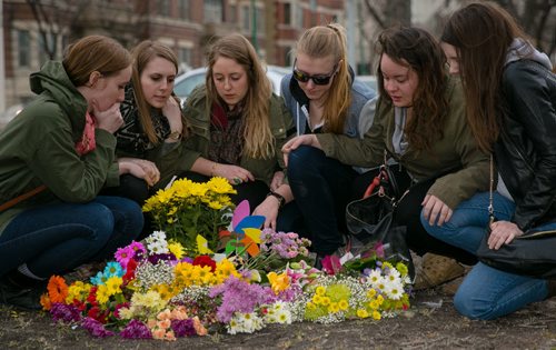 Kayla Prokopchuk (centre) is surrounded by childhood friends of Amy Gilbert at a memorial of flowers on Broadway at Donald Street, where Gilbert was struck and killed Saturday afternoon. The group of friends have known each other since Grade 7. From left to right, Megan Dudeck, Michelle Eacha, Kayla Prokopchuk, Merdith Stoesz, April Saurette, Angela Harris.    140409 - Wednesday, {month name} 09, 2014 - (Melissa Tait / Winnipeg Free Press)