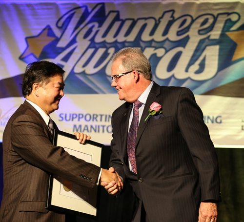 Lieutenant Governor, the Honourable Philip S. Lee, C.M., O.M., presents the Lieutenant Governor's Make a Difference Community Award to Peter Martin at the 31st Annual Volunteer Awards at the RBC Convention Centre in Winnipeg on Wednesday, April 9, 2014. The awards are intended to celebrate incredible volunteer service by individuals, organizations, and businesses of Manitoba. (Photo by Crystal Schick/Winnipeg Free Press/Winnipeg Free Press)