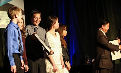 Devan Vercaigne, left to right, Victoria Turko, Nicolas Dutka, Duo Xu, and Sehee Park, accept the Lieutenant Governor's Make a Difference Community Award presented by Lieutenant Governor, the Honourable Philip S. Lee, C.M., O.M., right, to the volunteers from Highbury School at the 31st Annual Volunteer Awards at the RBC Convention Centre in Winnipeg on Wednesday, April 9, 2014. The awards are intended to celebrate incredible volunteer service by individuals, organizations, and businesses of Manitoba. (Photo by Crystal Schick/Winnipeg Free Press/Winnipeg Free Press)