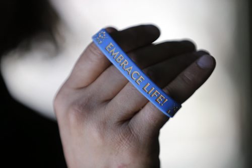 SUN EXTRA - wear an "embrace life " wrist band ,  Dennis Maione  writer  who beat cancer and now runs triathlons. Story is titled, What I Learned From Cancer.  April 11 2014 / KEN GIGLIOTTI / WINNIPEG FREE PRESS