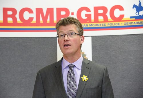 Justice Minister Andrew Swan announces the funding of ten new RCMP positions from the Manitoban government at the NCO mess hall,  RCMP "D" division in Winnipeg on Friday, April 11, 2014. The ten new positions will bring the provinces RCMP total to 798 positions. (Photo by Crystal Schick/Winnipeg Free Press/Winnipeg Free Press)