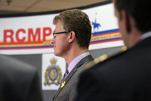 Justice Minister Andrew Swan announces the funding of ten new RCMP positions from the Manitoban government to dozens of RCMPs and media at the NCO mess hall,  RCMP "D" division in Winnipeg on Friday, April 11, 2014. The ten new positions will bring the provinces RCMP total to 798 positions. (Photo by Crystal Schick/Winnipeg Free Press/Winnipeg Free Press)