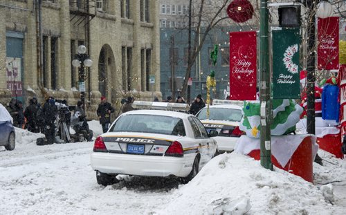 140412 Winnipeg - DAVID LIPNOWSKI / WINNIPEG FREE PRESS - April 12, 2014  Part of the Exchange district was blocked off, snow was brought in, and streets were sporting Christmas decorations for the filming of "One Christmas Eve" staring Anne Heche Saturday April 12, 2014