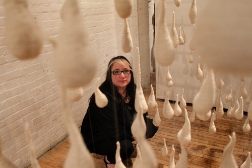 Odia  Reimer, daughter of Cliff and Wilma Derksen, poses next to 490 crocheted tear drops she created as part of "Inexplicable"  an art installation on healing that she is a part of with works from her parents. The show "Healing Through Creativity." opened Saturday evening at Frame Gallery, 318 Ross and runs through till April 27.  April 14  2014 Ruth Bonneville / Winnipeg Free Press