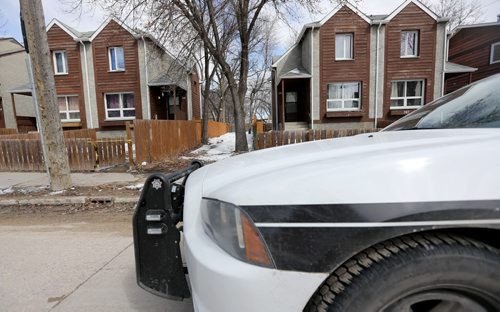 Winnipeg Police at the scene of Saturdays shooting that claimed the life of Geoffrey Oliver Reid, on the 300 block of Alexander Avenue, Sunday, April 13, 2014. (TREVOR HAGAN/WINNIPEG FREE PRESS)