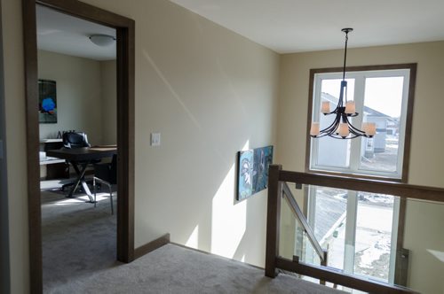 Landing on second floor looking into bedroom, currently set up as an office, at 8 Stan Bailie Drive in South Pointe.  EMILY CUMMING / WINNIPEG FREE PRESS APRIL 14, 2014