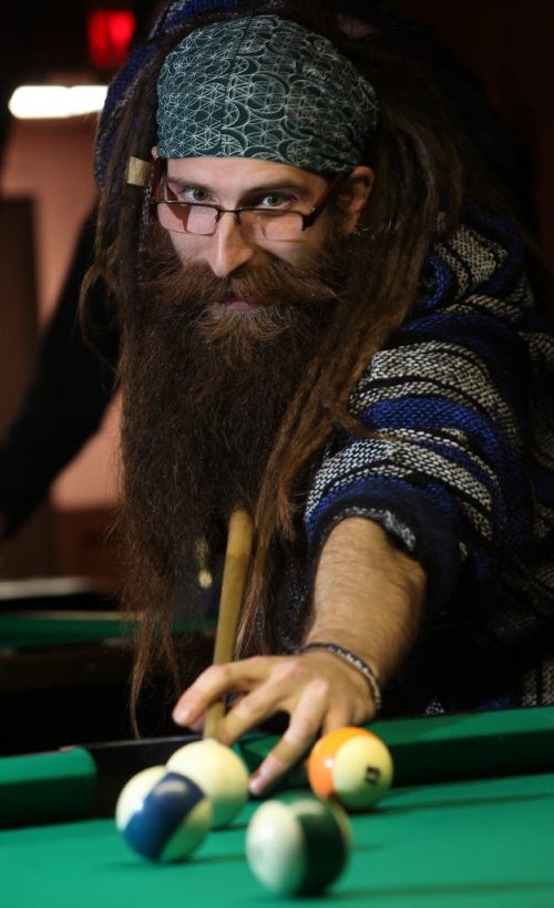 Kyle Carrier takes aim in a game of billiards at an evening meeting of the Manitoba Facial Hair Club. See Dave Sanderson story. April 14, 2014 - (Phil Hossack / Winnipeg Free Press)
