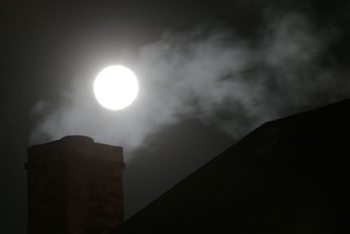 April 14, 2014 - 140414  -  The moon is seen over a St Boniface home Monday, April 14, 2014. John Woods / Winnipeg Free Press