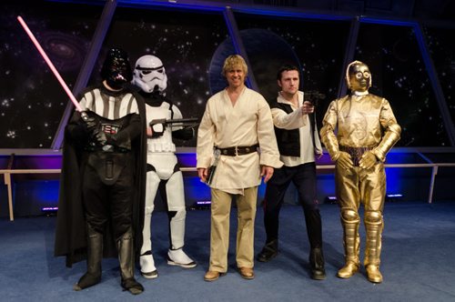 Christian actors take centre stage in preparation for "Rock Star Wars."  From left, Stephen Ashcroft (filing in for Jamie Wilson) as Darth Vader, Isaac Bueckert (audio technician for the performance) as a Stormtrooper, Derek Zeilstra as "Luke Moonwalker", Tim Hamm as "Solo", and Graham Hunt as C-3PO.  The Star Wars themed Easter service is expected to attract between 5-6 thousand spectators this weekend to the Church of the Rock.  Each year the church takes a different pop culture story and adapts it to tell the story of the resurrection of Jesus Christ.  EMILY CUMMING / WINNIPEG FREE PRESS APRIL 15, 2014