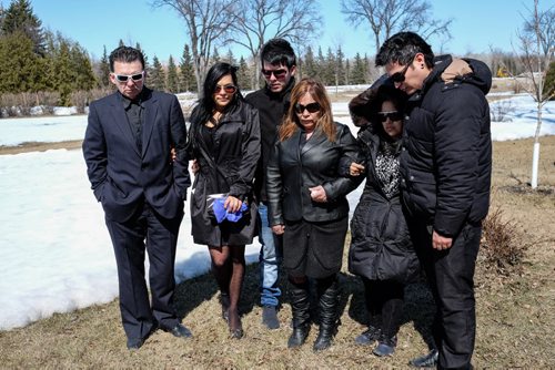 Members of the family of Baby Matias De Antonio just after the funeral at St. Vital Cemetery Wednesday afternoon. (l-r) Grandfather Guillermo, auntie Gina, uncle Johandre, grandmother Amilse, mother Maria and uncle Carlos. 140416 - Wednesday, April 16, 2014 -  (MIKE DEAL / WINNIPEG FREE PRESS)