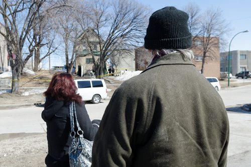 June Jubinville and Tim Macklin stand across the street from their home on the 300 block of Enfield Crescent near Marion Street.  The basement resident died as a result of the fire.  The cause of the fire is under investigation.  EMILY CUMMING / WINNIPEG FREE PRESS APRIL 16, 2014