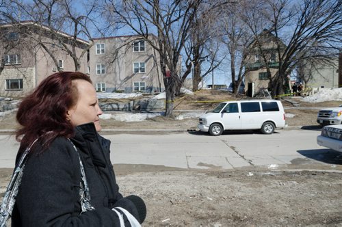 June Jubinville stands across the street from her home on the 300 block of Enfield Crescent near Marion Street.  The basement resident died as a result of the fire.  The cause of the fire is under investigation.  EMILY CUMMING / WINNIPEG FREE PRESS APRIL 16, 2014