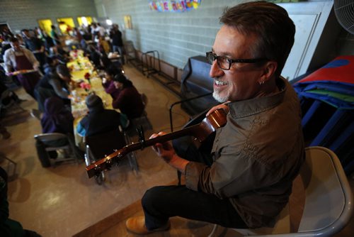 Juno winner Steve Bell plays while Agape Table serving Easter breakfast meal to hundreds after long winter .April 15 2014 / KEN GIGLIOTTI / WINNIPEG FREE PRESS Agape Table (All Saints Church) , an agency providing nutritious meals in the West Broadway community since 1980, is celebrating the end of winter and the hope of spring with a special Easter breakfast meal.¬ Community leaders and special volunteers like Winnipeg Blue Bombers alumnus Chris Cvetkovic will be serving breakfast to Agape Table guests from 8:00 - 10:30 am, and Juno-award winning musician Steve Bell will be playing some music at 8:30am.Over 300 people are expected between 8:00 - 10:30 am