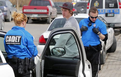 A kid on a bicycle gets ticked for something at the Forks by police cadets. NO OTHER INFO ON THIS INCIDENT.  BORIS MINKEVICH / WINNIPEG FREE PRESS April 18, 2014