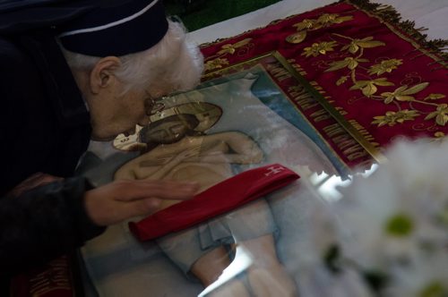 A nun kisses the shroud depicting Jesus Christ at the alter at Sts. Vladimir & Olga Metropolitan Cathedral during the Placement of the Plaschanytsia service on Good Friday.  EMILY CUMMING / WINNIPEG FREE PRESS APRIL 17, 2014