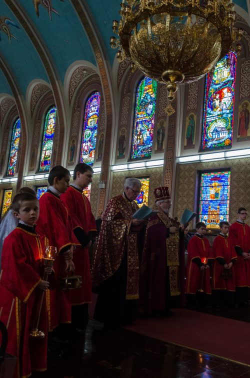 Clergy and parishioners stand facing the alter at the Sts. Vladimir & Olga Metropolitan Cathedral during the Placement of the Plaschanytsia service on Good Friday.  EMILY CUMMING / WINNIPEG FREE PRESS APRIL 17, 2014