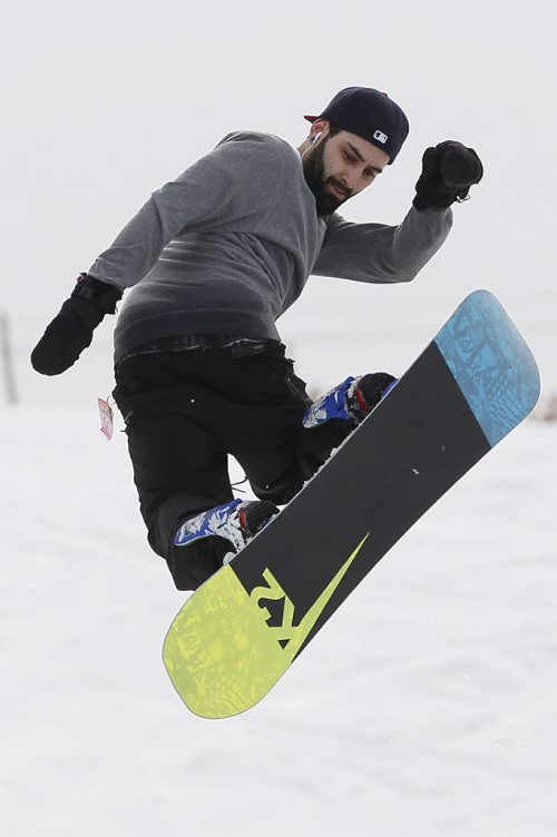 April 18, 2014 - 140418  -  Stephen Craveiro takes off the wall at Stony Mountain Ski Area Friday, April 18, 2014. This is the last day of boarding at the hill. John Woods / Winnipeg Free Press