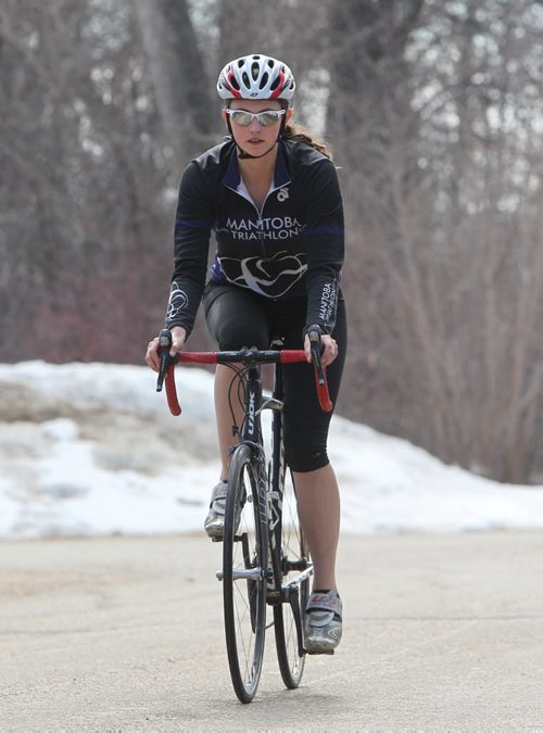 Triathlon athlete Ashlyn Cortvriendt trains at Kings Park. For Ashley Prest's Training Basket column. April 19, 2014 Ruth Bonneville / Winnipeg Free Press