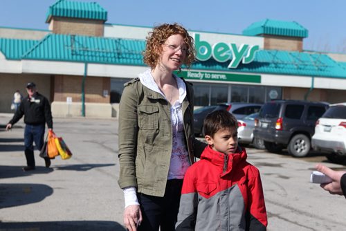 Michelle Lagadi talks to a reporter int he parking lot of Sobey's in St. Vital about the incidences of measles in the province as she heads out shopping with her son Ethan Saturday. See story. April 19, 2014 Ruth Bonneville / Winnipeg Free Pres