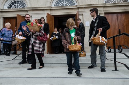 Parishioners stand on the front steps of Sts. Vladimir & Olga Metropolitan Cathedral after having their Easter basket blessed during the Blessing of Easter Paska service. EMILY CUMMING / WINNIPEG FREE PRESS APRIL 19, 2014