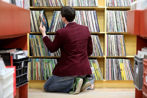Aaron Tryon shops for records at Into the Music on McDermot Avenue on Record Store Day, Saturday, April 19, 2014. (TREVOR HAGAN/WINNIPEG FREE PRESS)