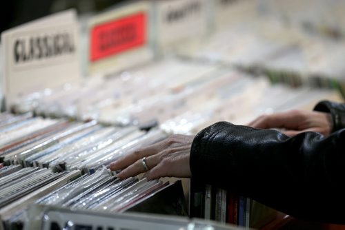 People shop for records at Into the Music on McDermot Avenue on Record Store Day, Saturday, April 19, 2014. (TREVOR HAGAN/WINNIPEG FREE PRESS)