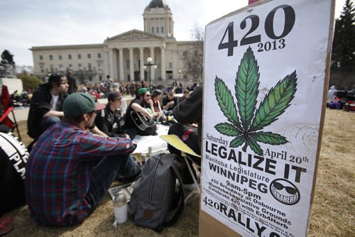 April 20, 2014 - 140420  -  A posted sign from last year indicates the purpose of today's gathering at the Manitoba Legislature Sunday, April 20, 2014. People gathered to enjoy some pot and protest Canada's marijuana laws on the grounds without interference from police. John Woods / Winnipeg Free Press