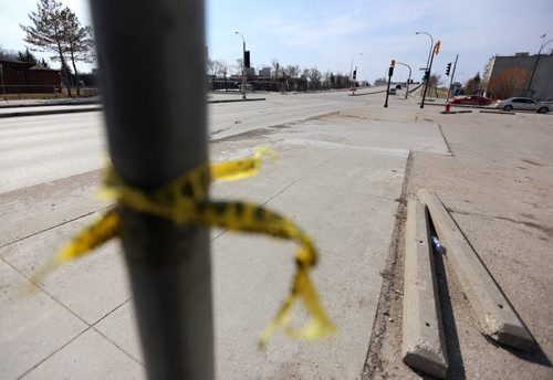 Police tape near the intersection of Dufferin and Salter, Sunday, April 20, 2014. A 17 year-old was killed and an 18 year-old was inured in an incident last night. (TREVOR HAGAN/WINNIPEG FREE PRESS)