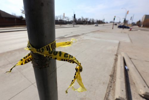 Police tape near the intersection of Dufferin and Salter, Sunday, April 20, 2014. A 17 year-old was killed and an 18 year-old was inured in an incident last night. (TREVOR HAGAN/WINNIPEG FREE PRESS)