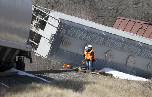 CN Rail employees at the scene after a few cars derailed on a section of track next to Pembina Highway in St.Norbert, Sunday, April 20, 2014. There were no injuries, and the contents pose no environmental risk. (WINNIPEG FREE PRESS)