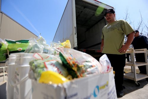 Food is removed and redistributed from of Golden Links Lodge after basement flooding caused a power failure, Sunday, April 20, 2014. 86 residents were evacuated after a disaster protocol was implemented around 3am. (TREVOR HAGAN/WINNIPEG FREE PRESS)